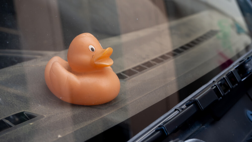 Squeaky duck on a car's dashboard. - why your SUV squeaks