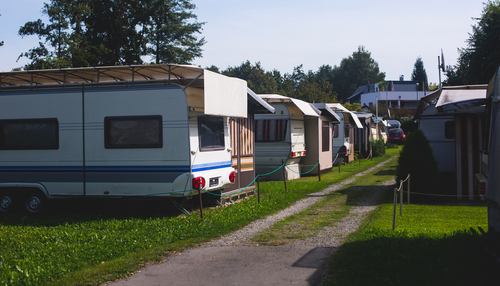 white RVs under tents