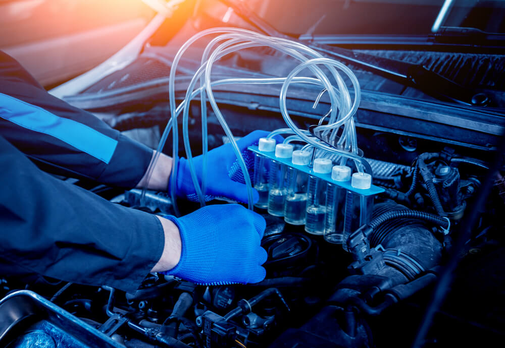 Cleaning engine injectors. Car repair. Service station - luxury cars bad mileage